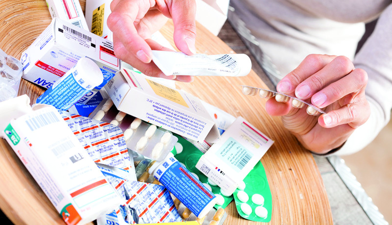 Hand holding medication pills