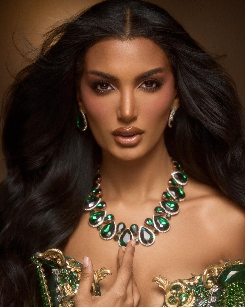 Woman wearing emerald necklace