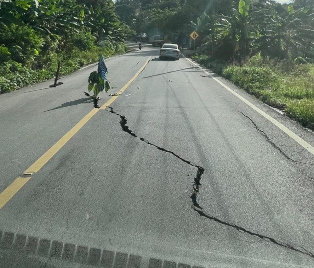 Asphalt road with large crack