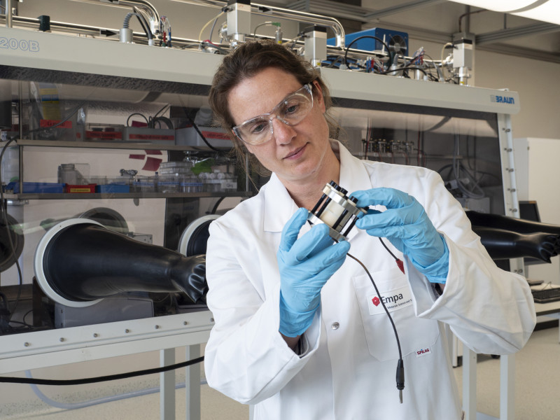 Scientist examining laboratory equipment