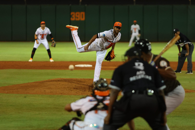 Baseball pitcher throwing from mound