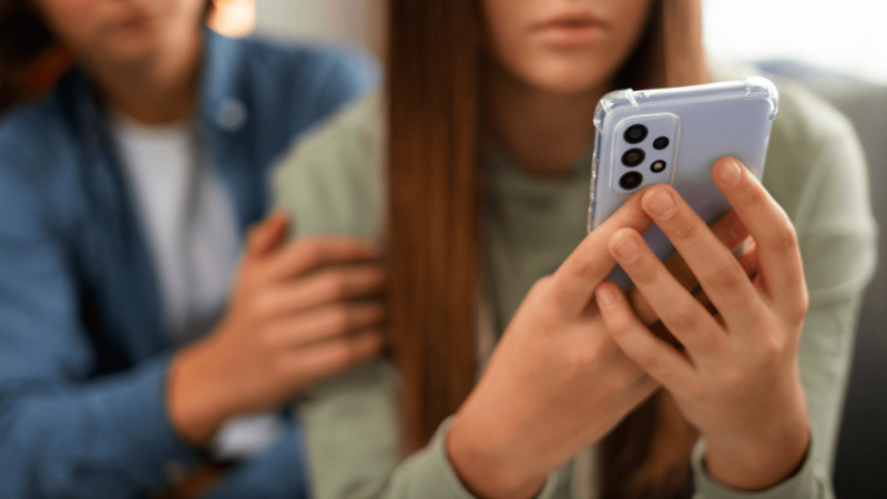 Woman using smartphone outdoors