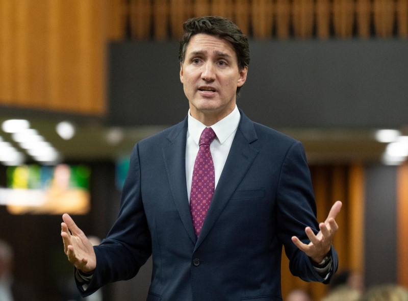 Trudeau in dark suit speaking