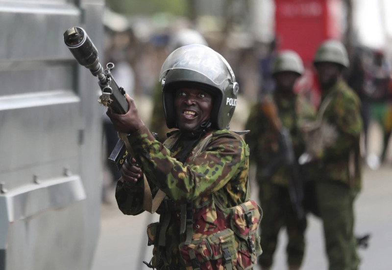 Riot police holding shield and helmet