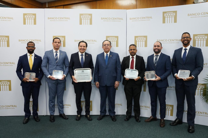 Men holding glass awards