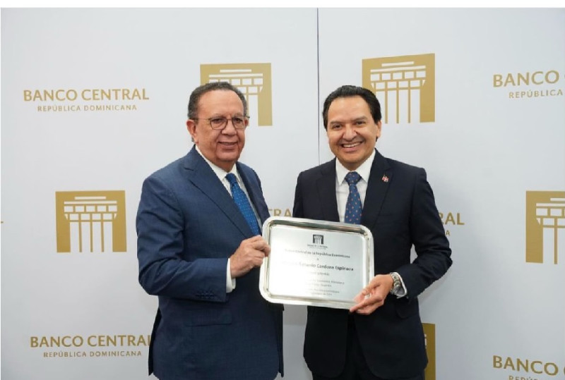 Man receiving award plaque