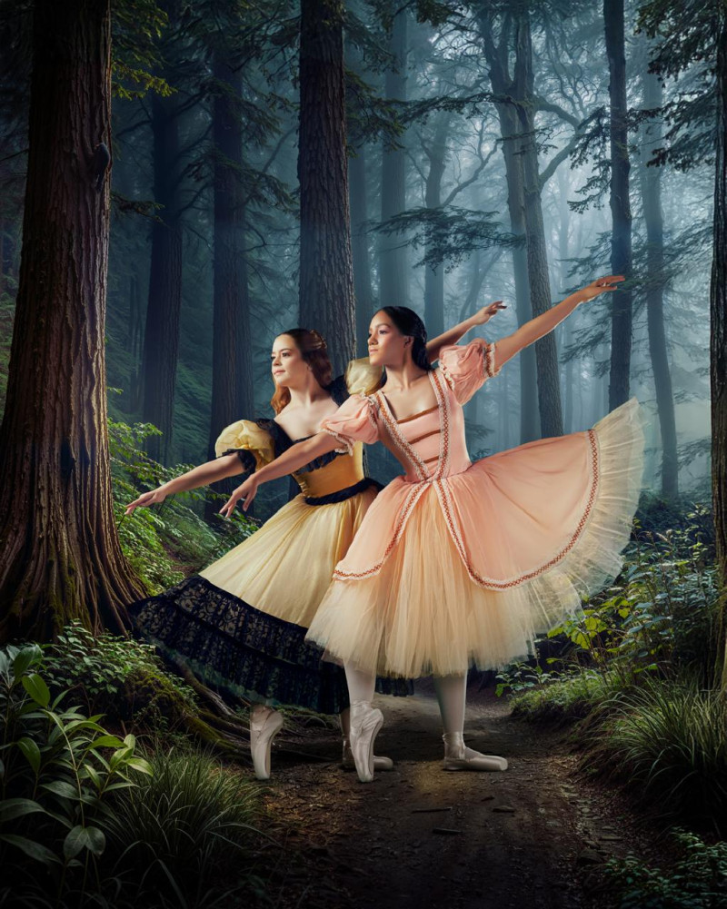 Two dancers performing in woodland